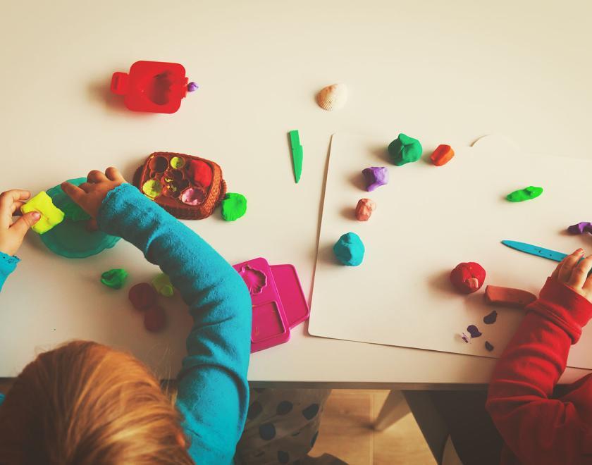 Children sitting making crafts
