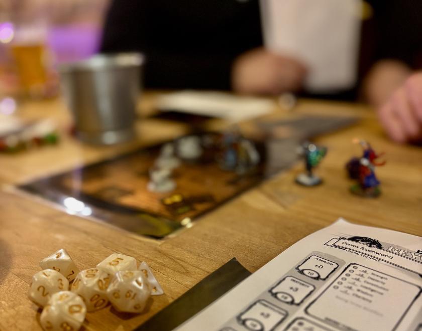 A DnD setup at the bar with people playing