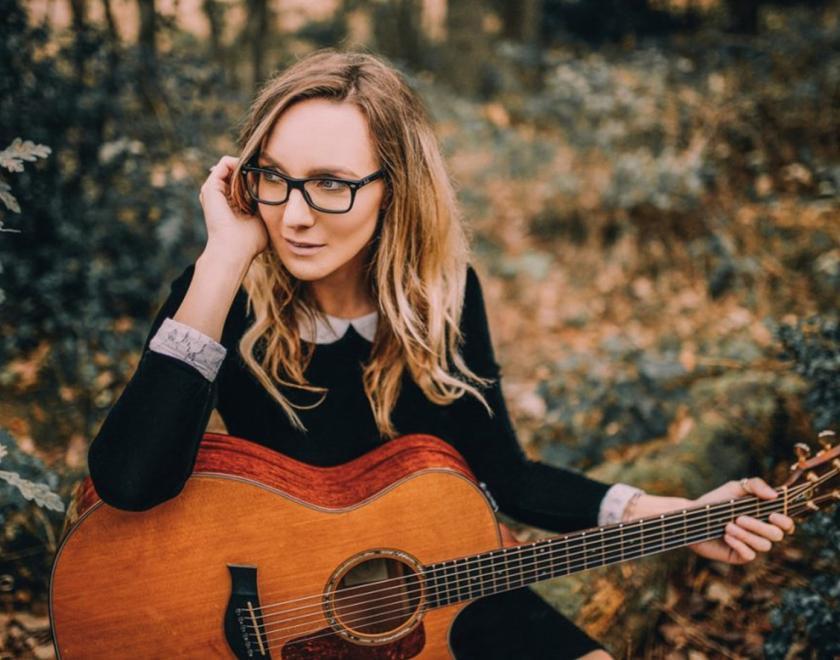 Emma Stevens with guitar