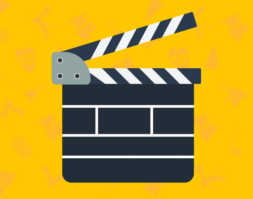 A clap board on a yellow background