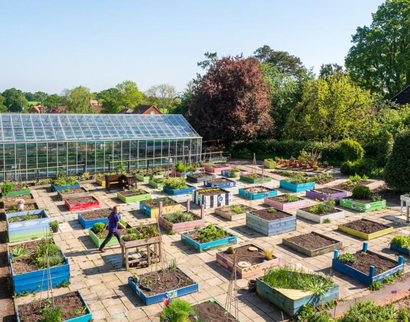 Gardens with planters and greenhouses