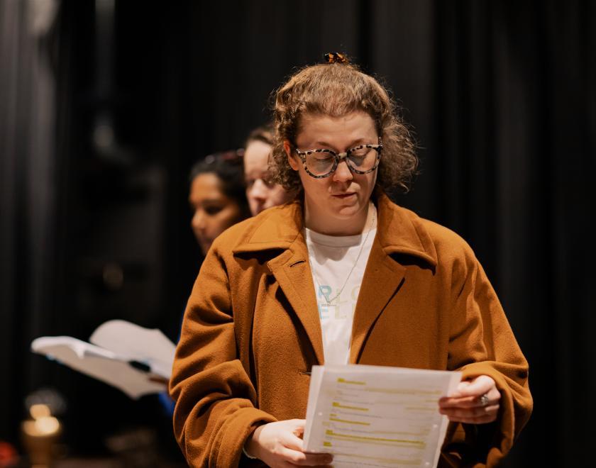 Lady reading a script