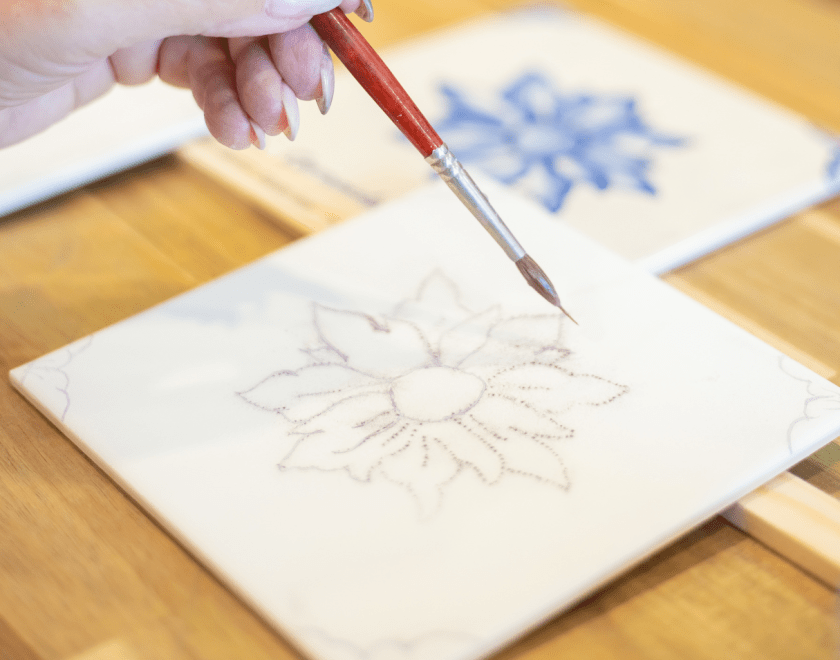 Hand painting a tile