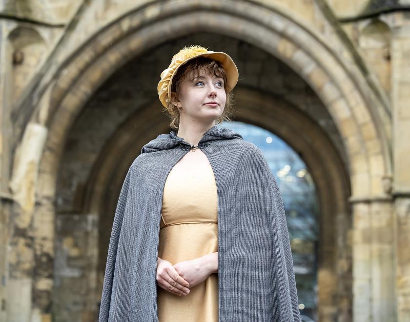 Volunteer Dressed as Jane Austin outside The Abbey Gateway