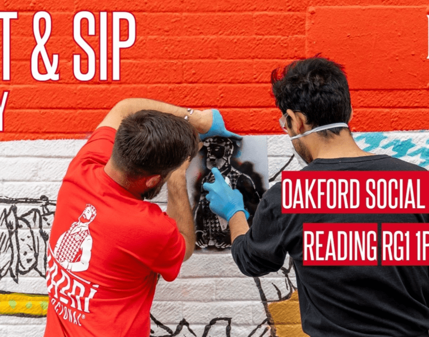 Two men shown from behind doing spray-can art on a wall with the title "Madri Paint & Sip"