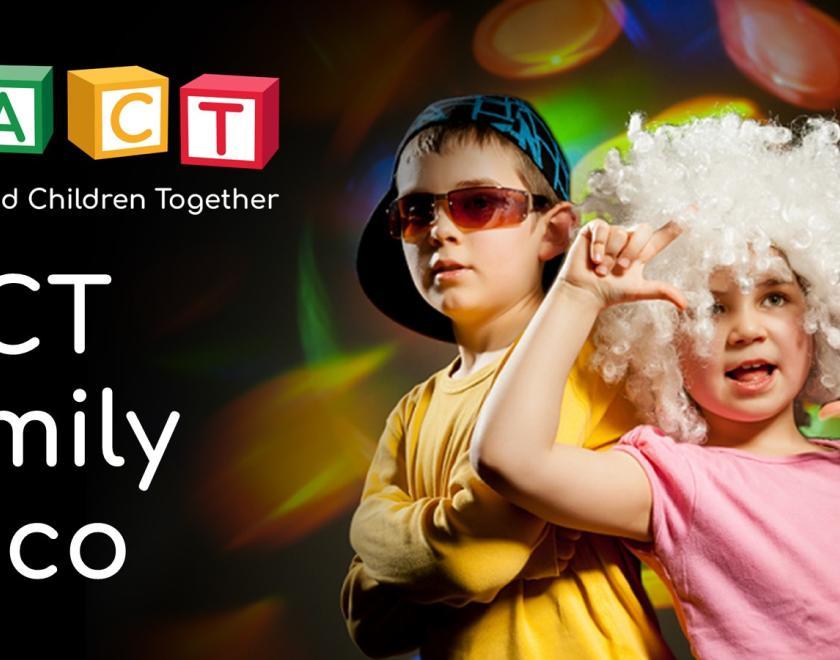 Two children dressed up ready for a disco