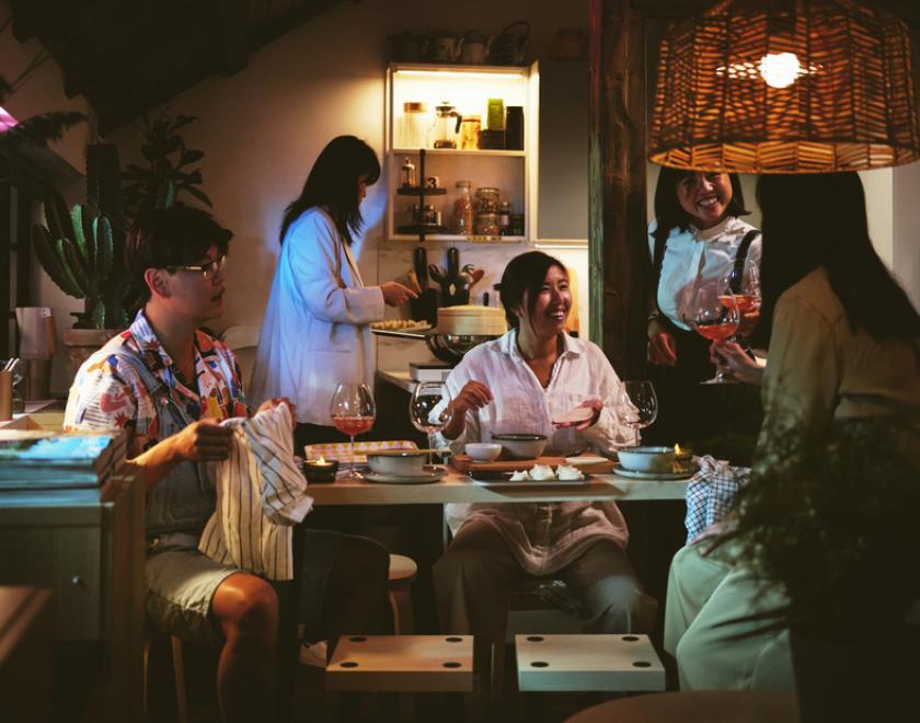 Friends gathered eating and drinking in their Pjs