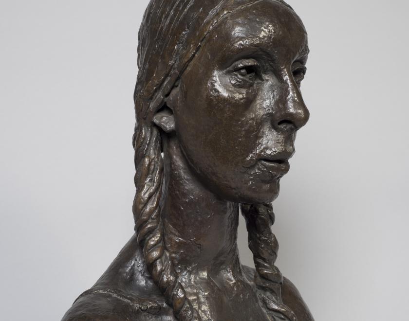 Bust of woman  with plats