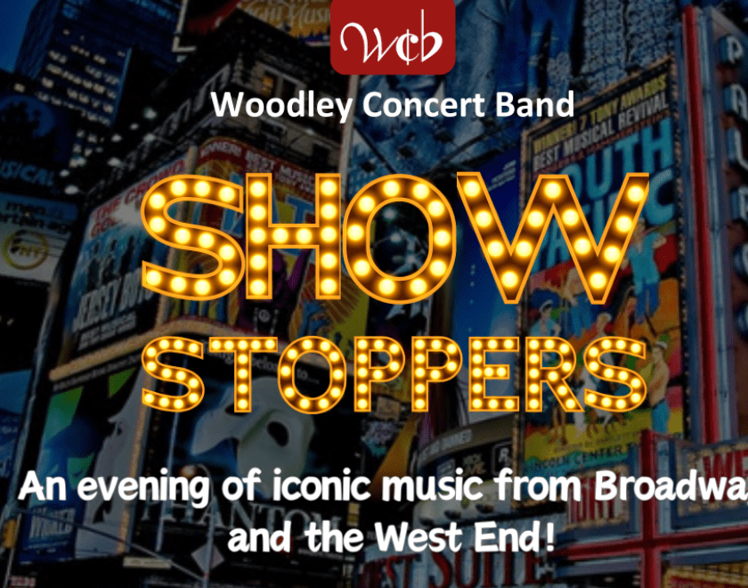 Banner image for Showstoppers concert with text "Showstoppers - an evening of iconic music from Broadway and the West End' set over an image of Broadway billboards.