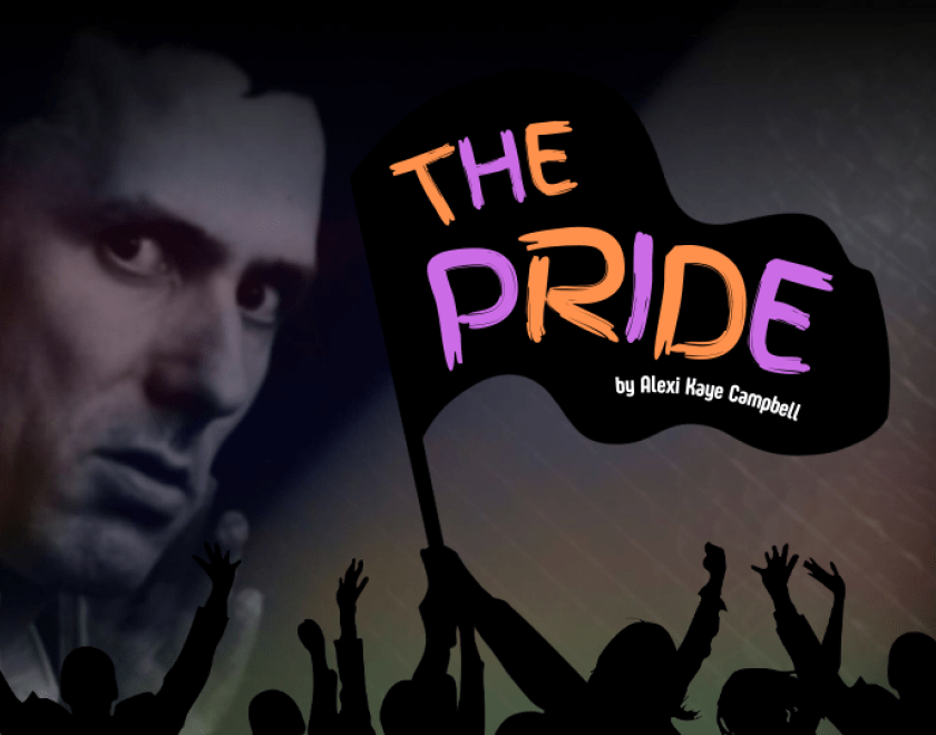 A man staring angrily out behind a flag with 'The Pride by Alexi Kaye Campbell' on it, held by a crowd of celebrating people