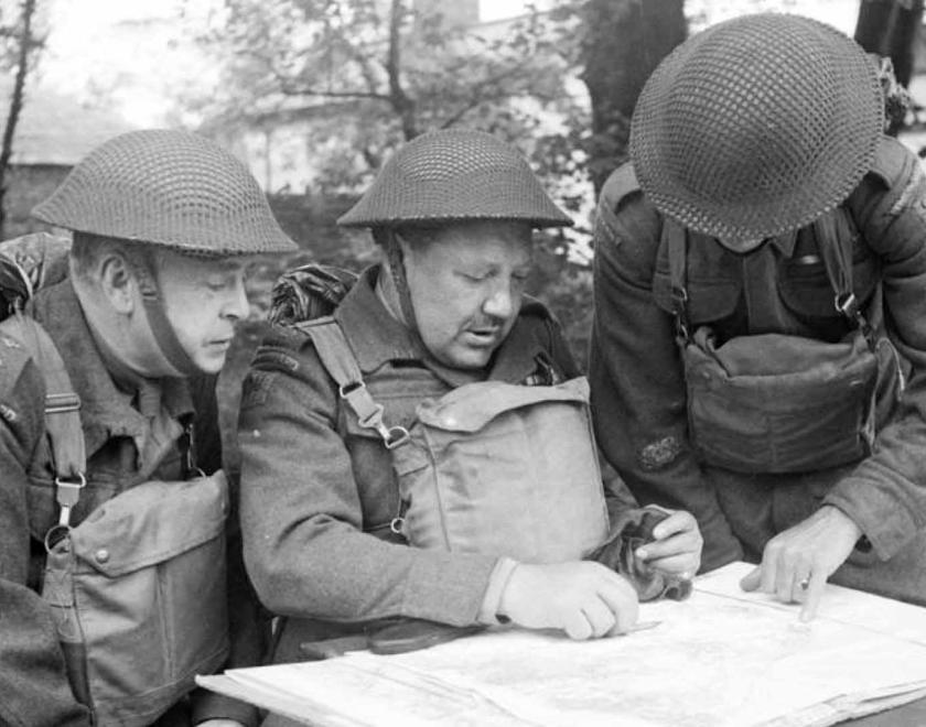 members of the Home Guard studying a map