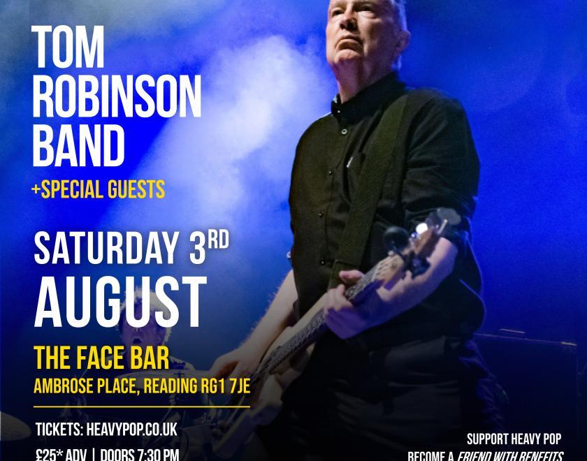 A pic of tom robinson playing bass