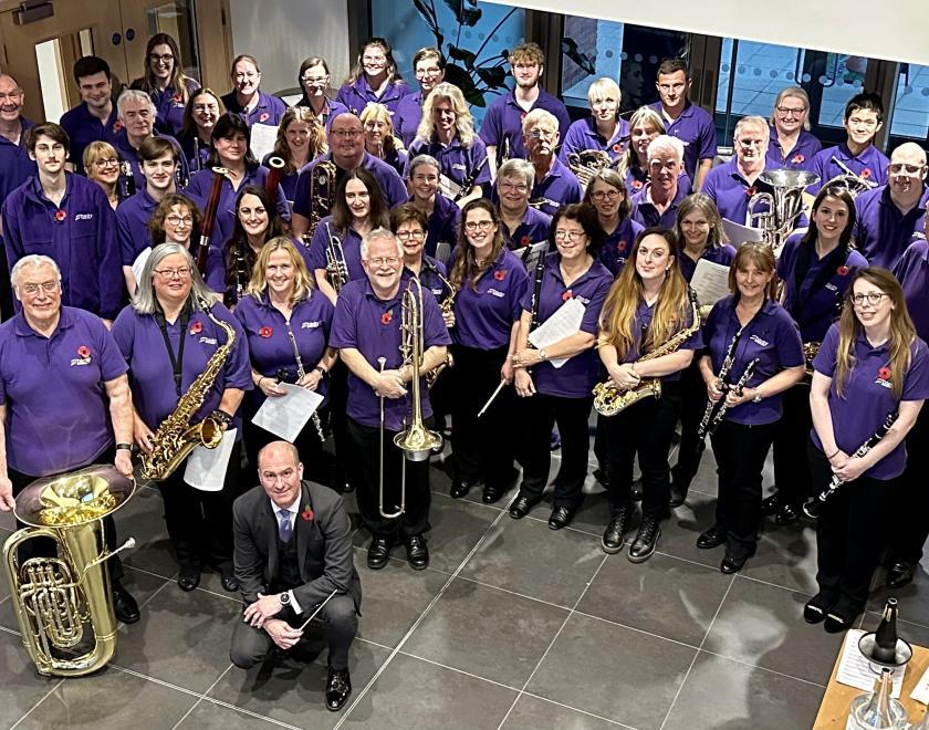 Members of Trinity Concert Band with their instruments - photo taken from above