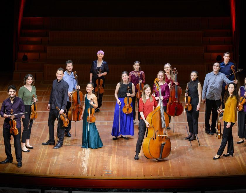 USE players standing on stage