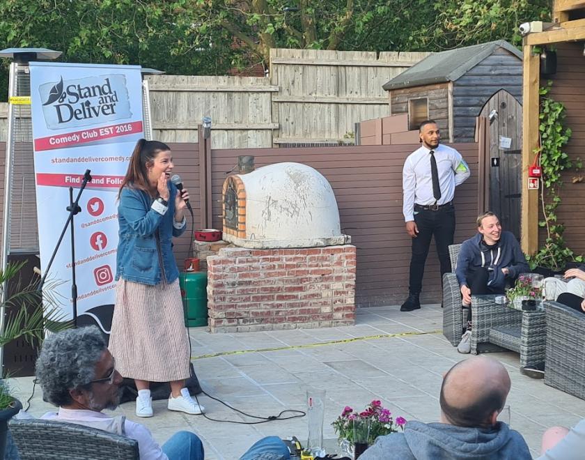 A picture the Stand and Deliver logo on a cinema screen 