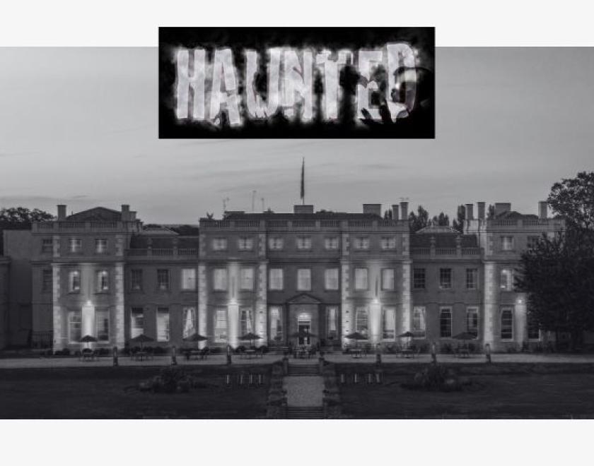 The image shows a black and white photo of the Mansion House with the word "Haunted" at the top in the centre of the image.
