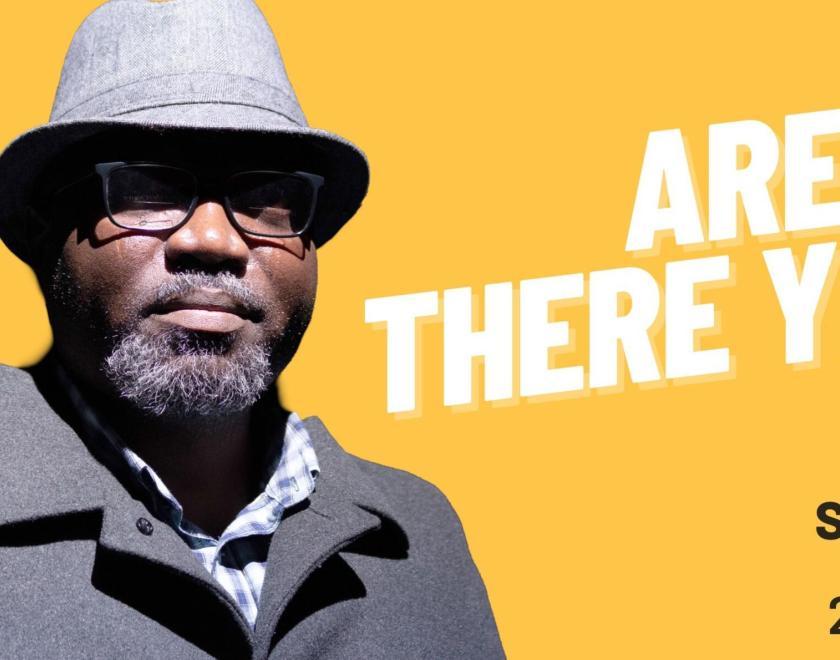 Poster with a balck man in a coat and trilby hat