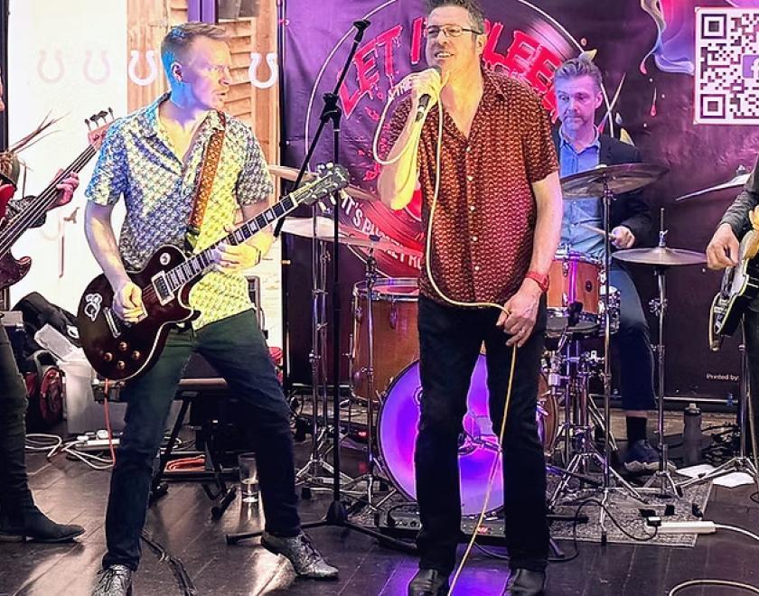 Five musicians on stage