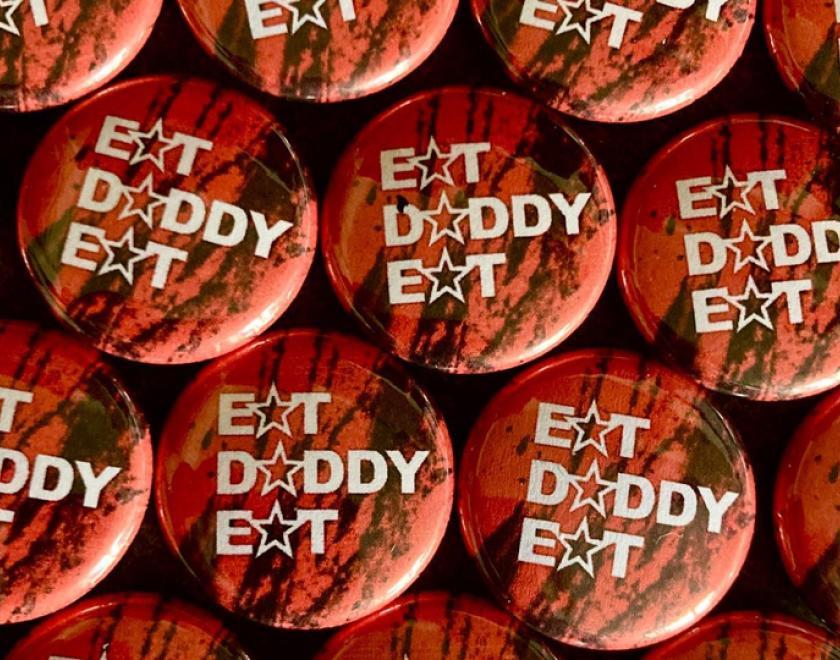 Badges adorned with Eat Daddy Eat text
