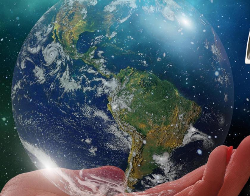 A hand holding the Earth