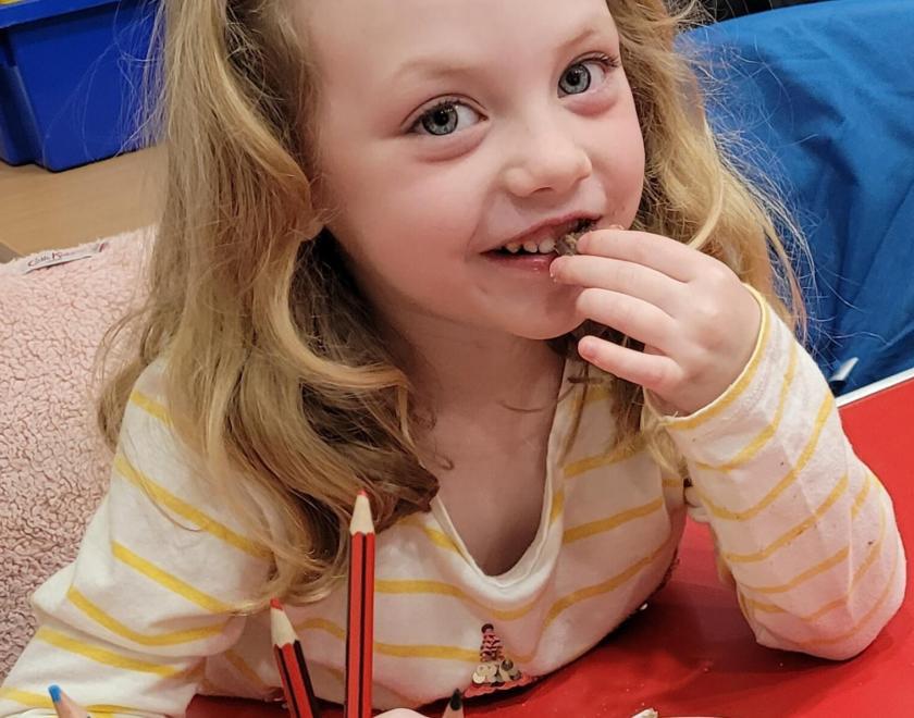 a girl eating chocolate