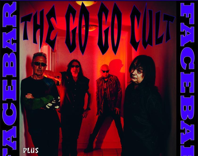 rock band the Gog Go cult looking moody in a corridor