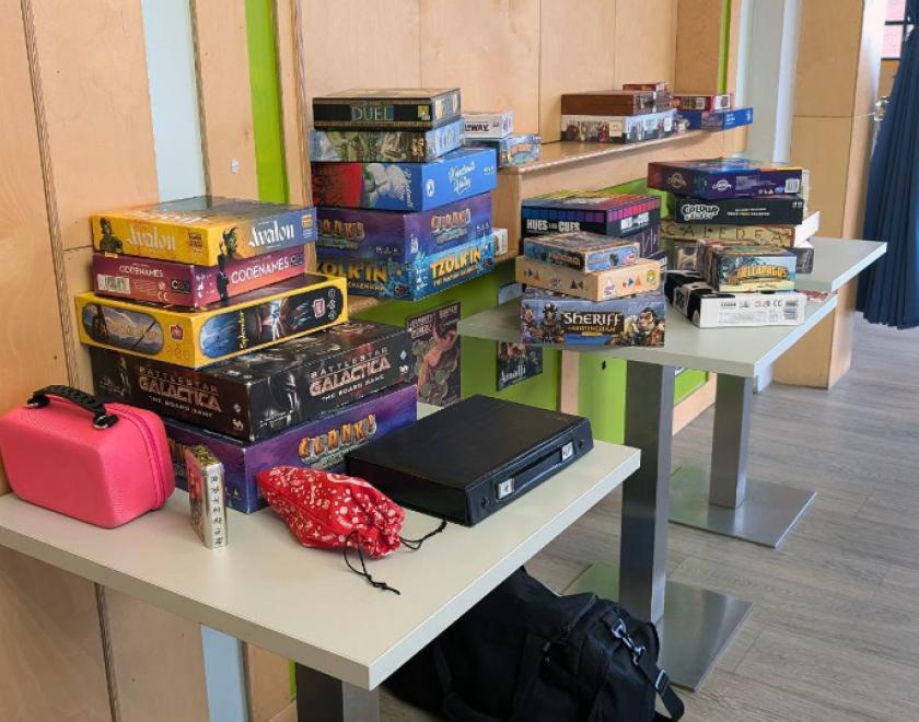A stack of board games on a table