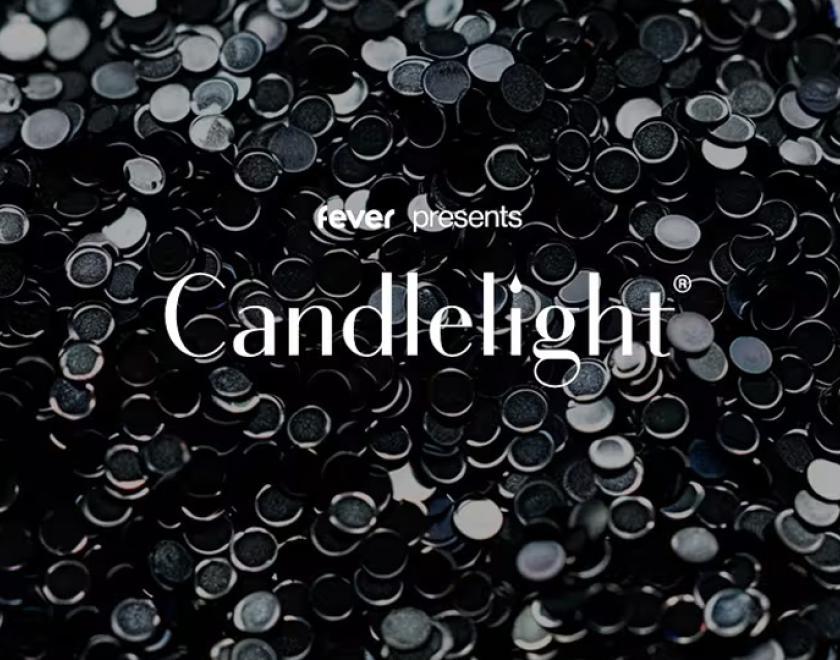 The word "candlelight" over an image of black, shimmering beads