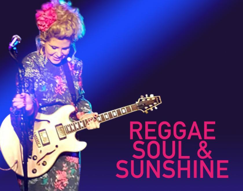 Singer Jewels Vass with a guitar on a purple background