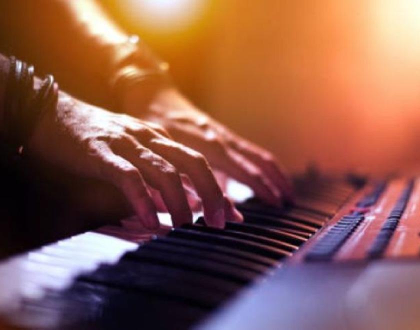 student playing a keyboard