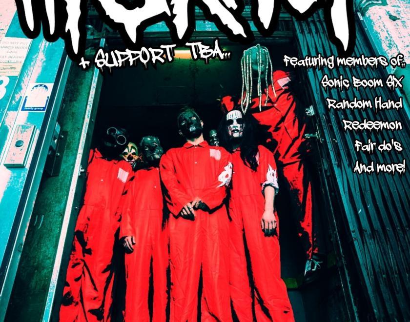 Tribute band dressed as Slipknot in orange boiler suits and masks