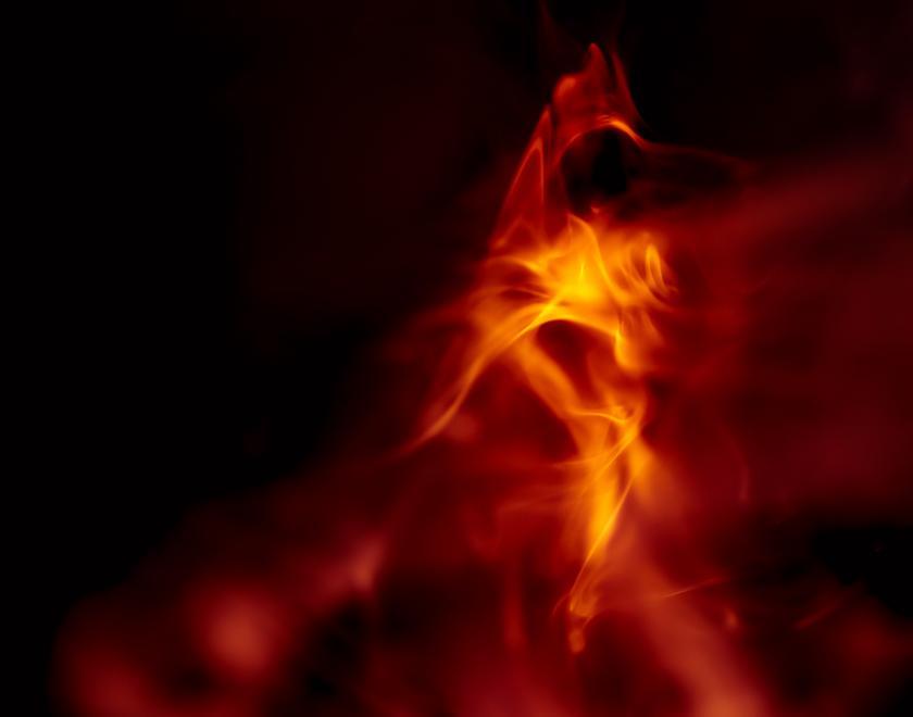 Dark background with hazy orange flames
