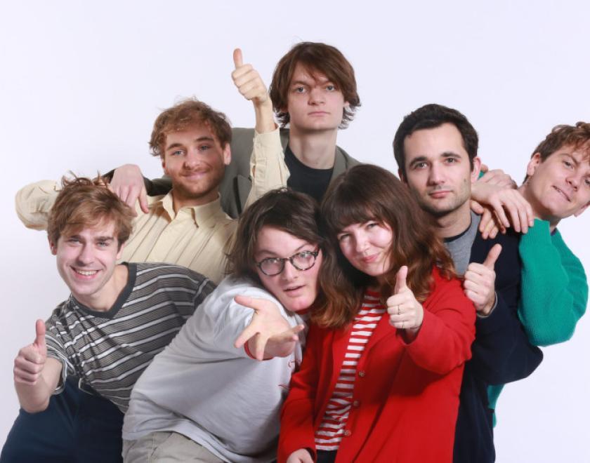 Personal Trainer stood in a group with thumbs up