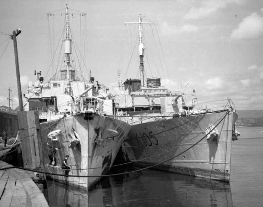 Royal Navy boats moored at a quayside during World War Two