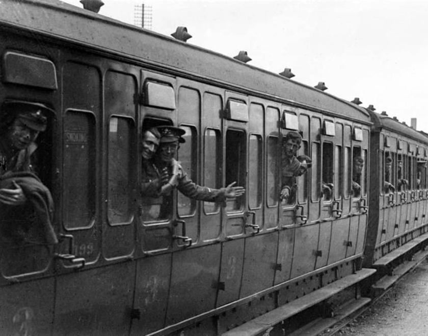 troops on a train waving goodbye