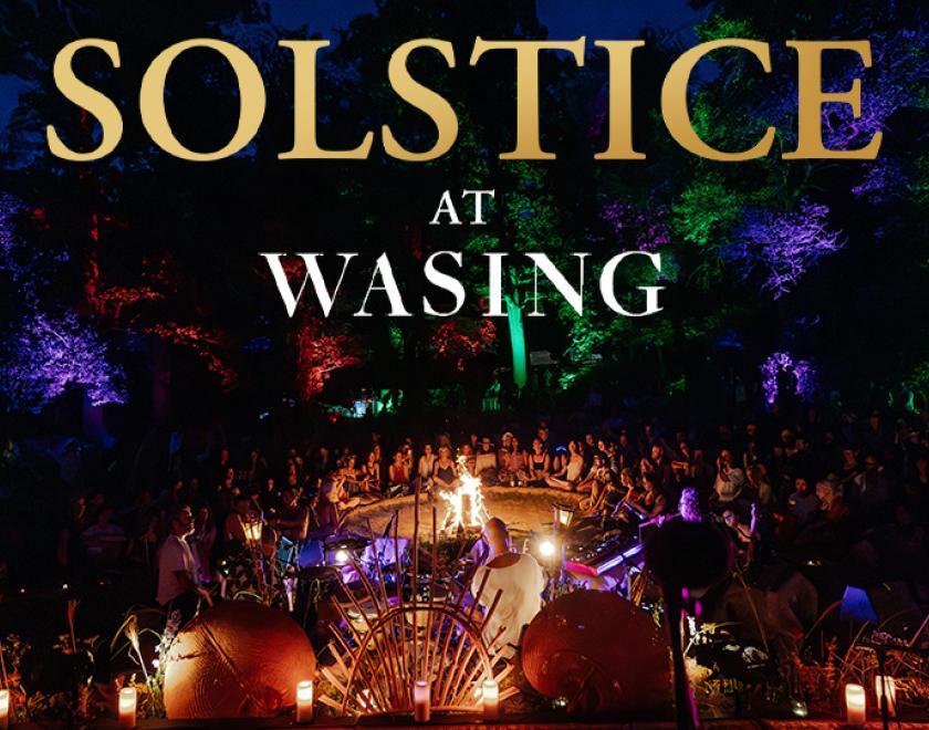 Solstice at Wasing title over an image of people celebrating in the woodland around a fire