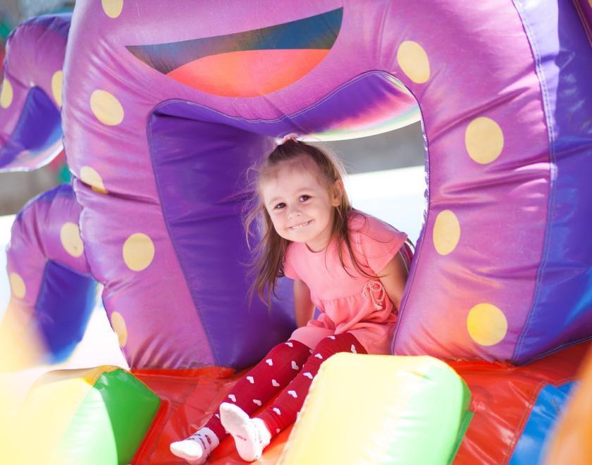 Young girl on a bouncy castle