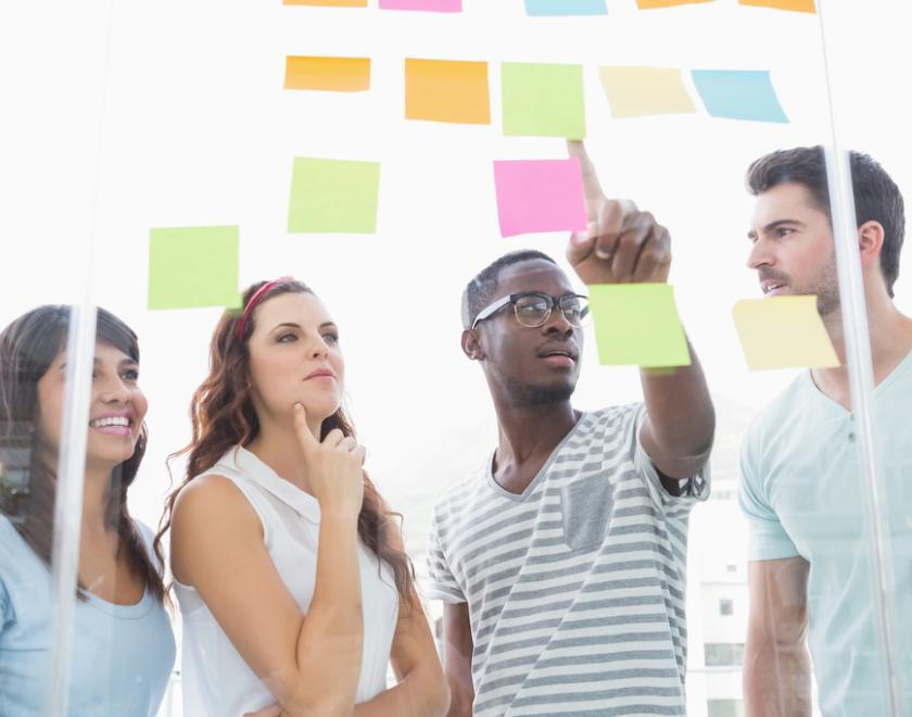 People collaborating using post-it notes